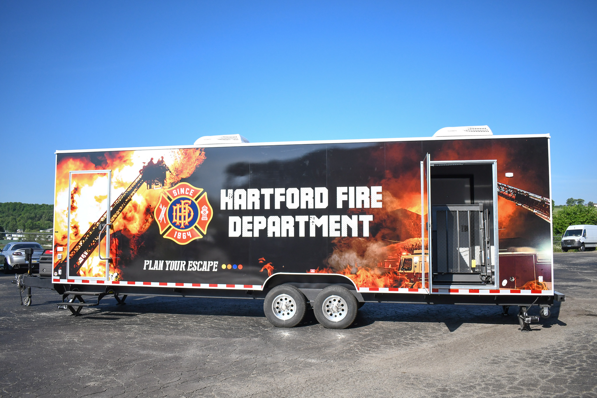 Side view displaying the wheelchair lift on the unit for Hartford, CT.