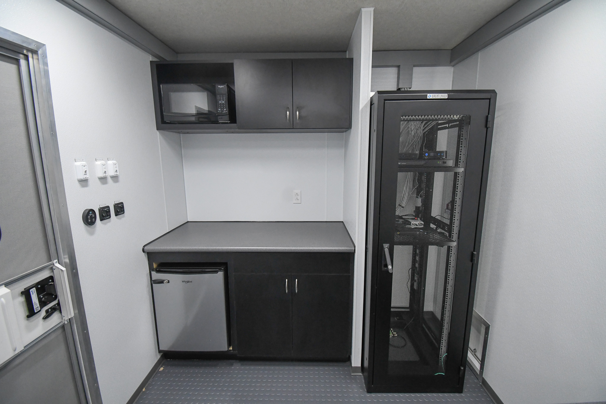 The kitchenette and electrical cabinet inside the unit for Albemarle, SC.