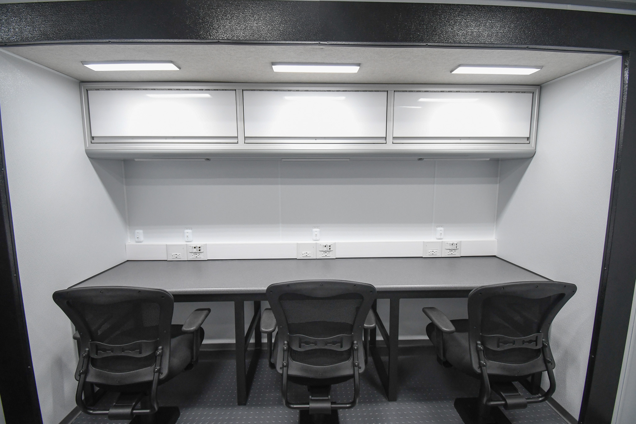 Three of five workstations inside the unit for Kinston, NC.