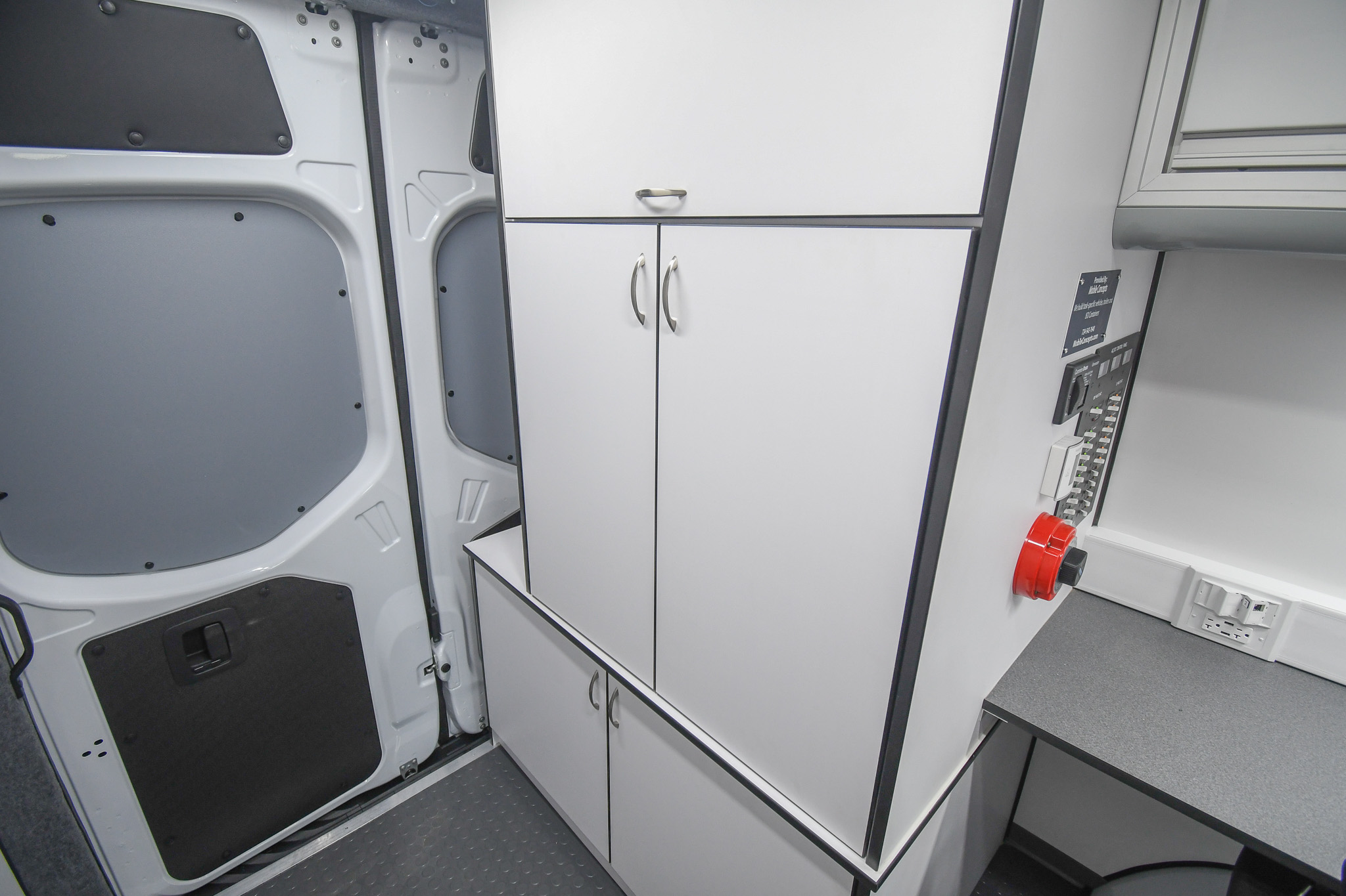 The storage cabinets (top two) and generator cabinet (bottom) inside the unit for Chicago, IL.