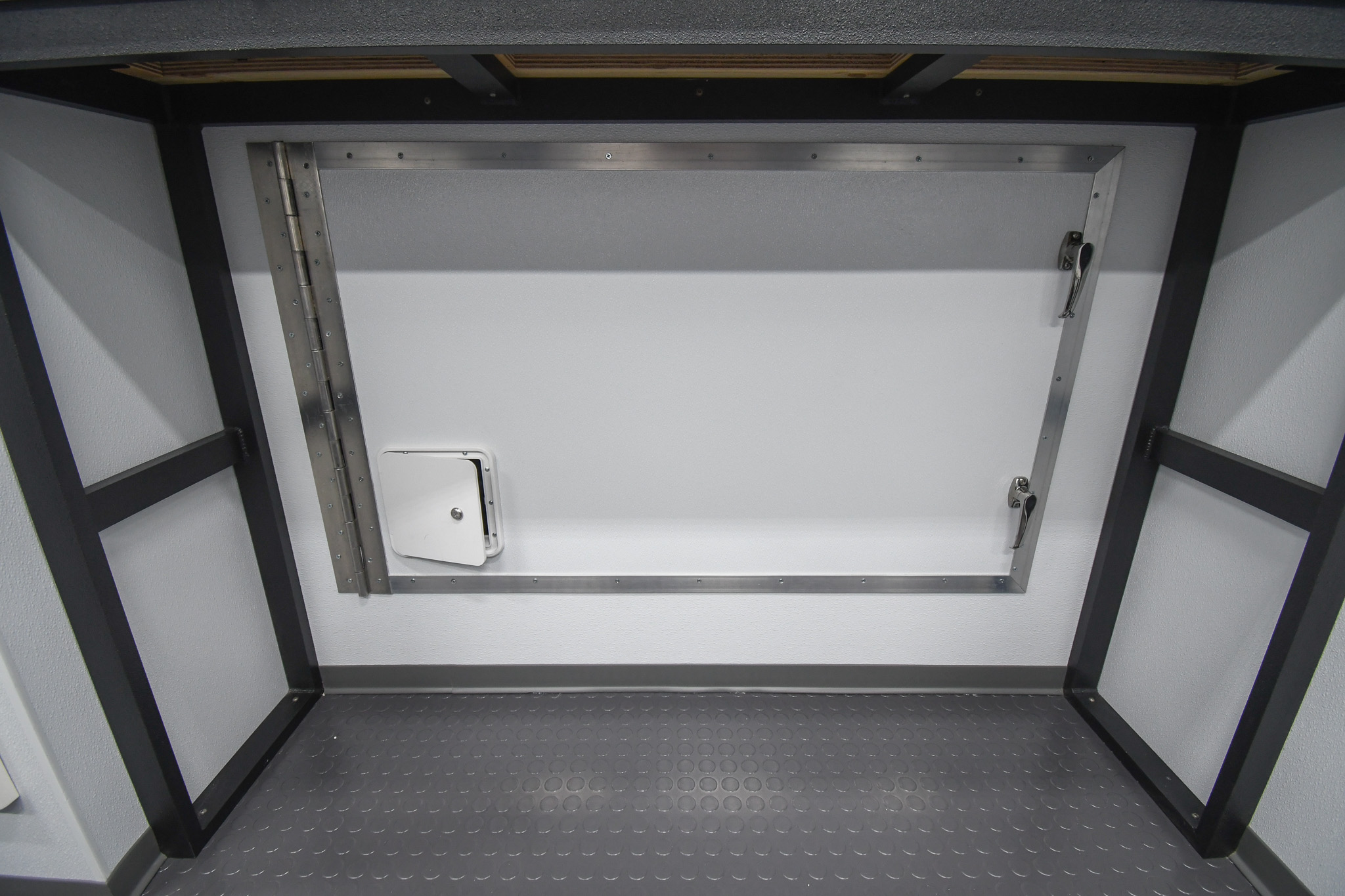 A view of the compartment containing a 50" Samsung LED TV behind a roll up door inside the unit for Bartlett, TN.