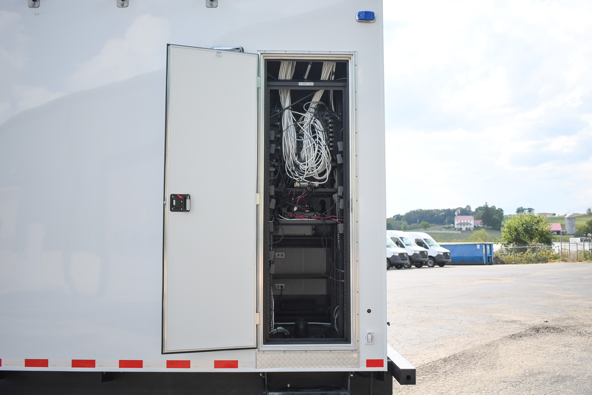 An exterior view of the unit for Bartlett, TN. The door to access the electronics rack from outside is open.