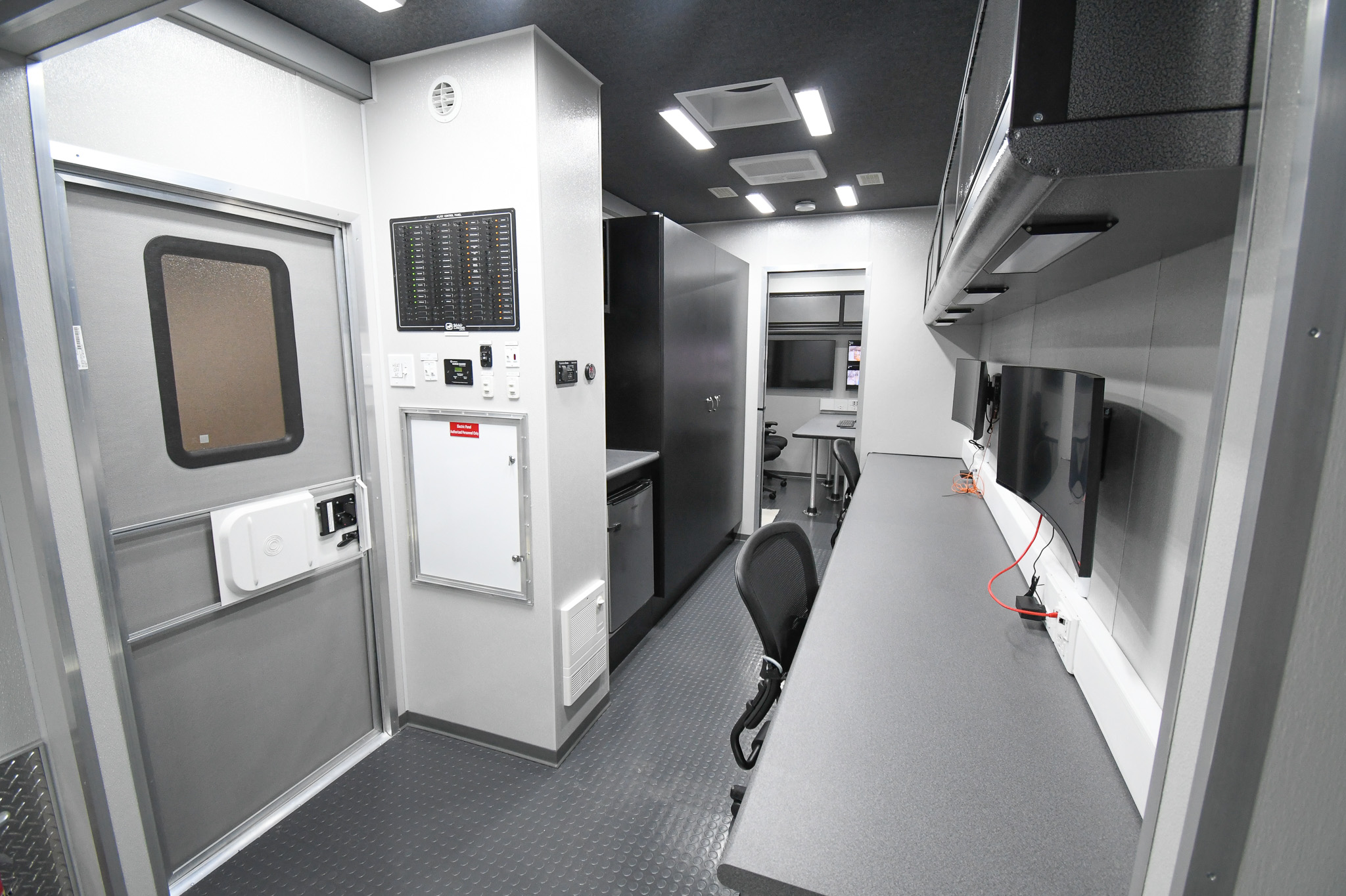 A view of the workstations, kitchenette, and conference room inside the unit for Mechanicsburg, PA.