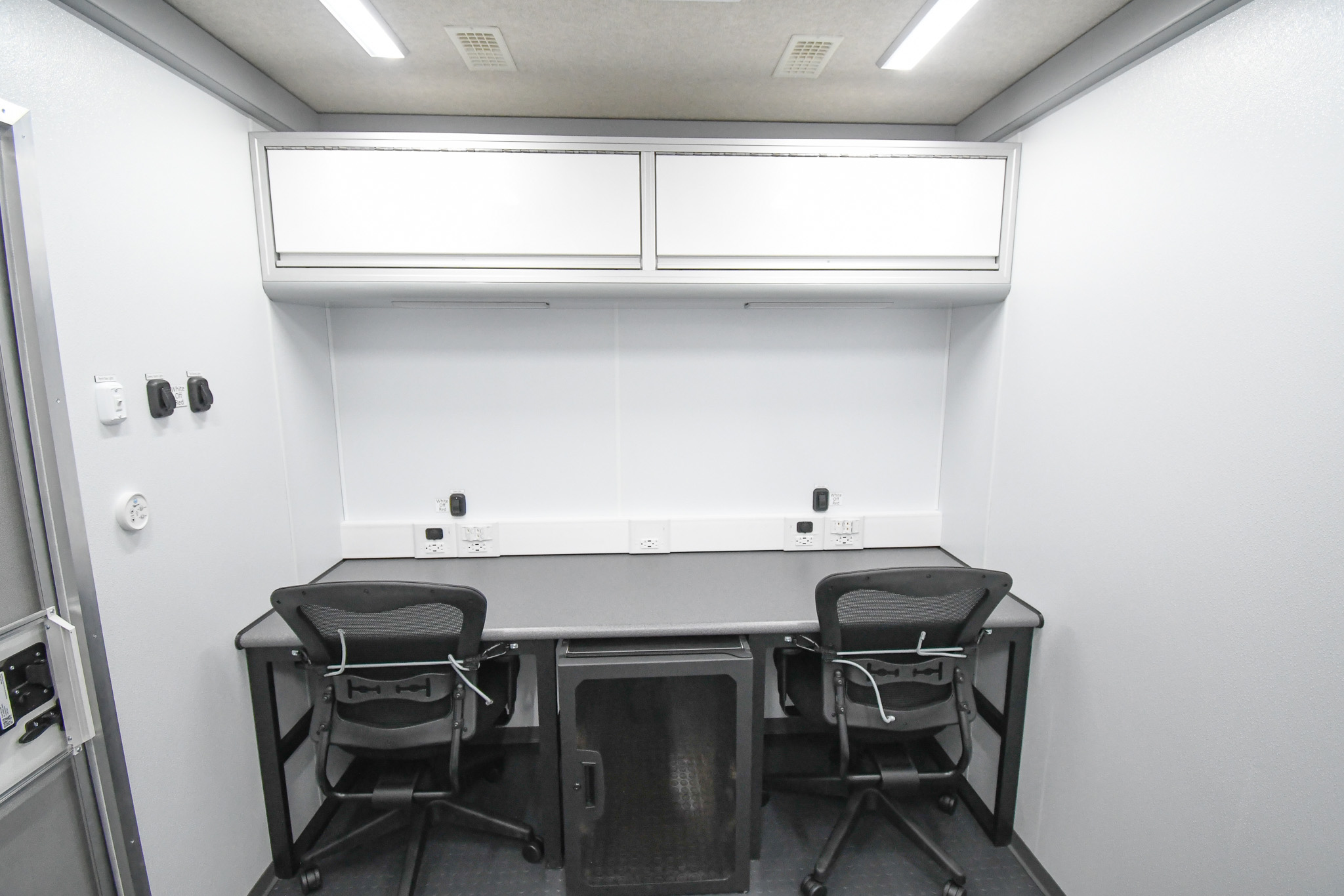 Two workstations and the electronics rack inside the unit for Columbiana, OH.