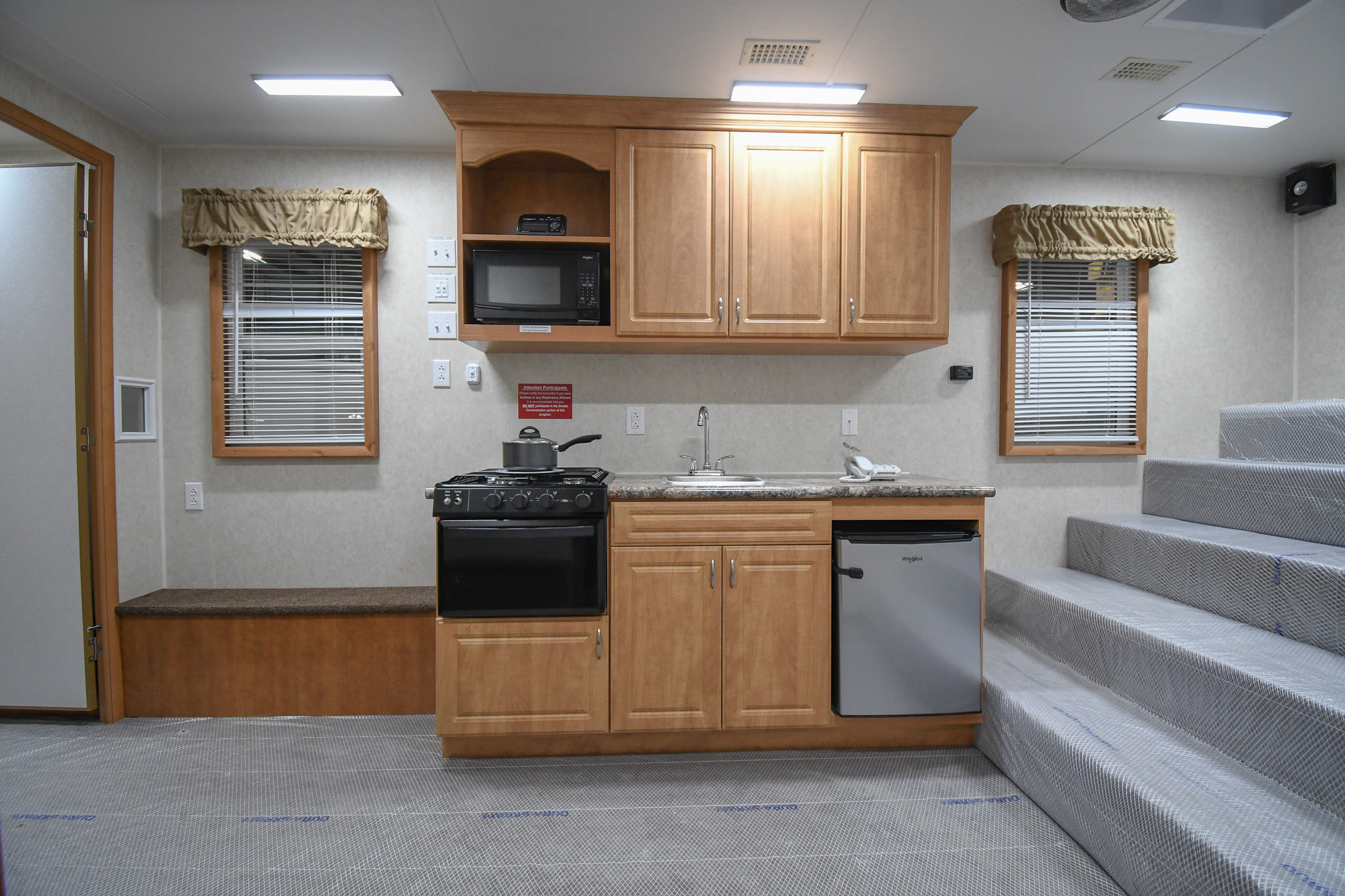 The kitchen stage and bleacher seating inside the unit for Modesto, CA.