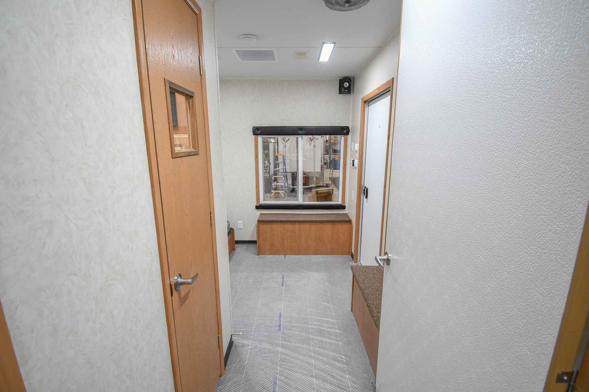 An interior view inside the unit for Modesto, CA. The door to the control room is closed.