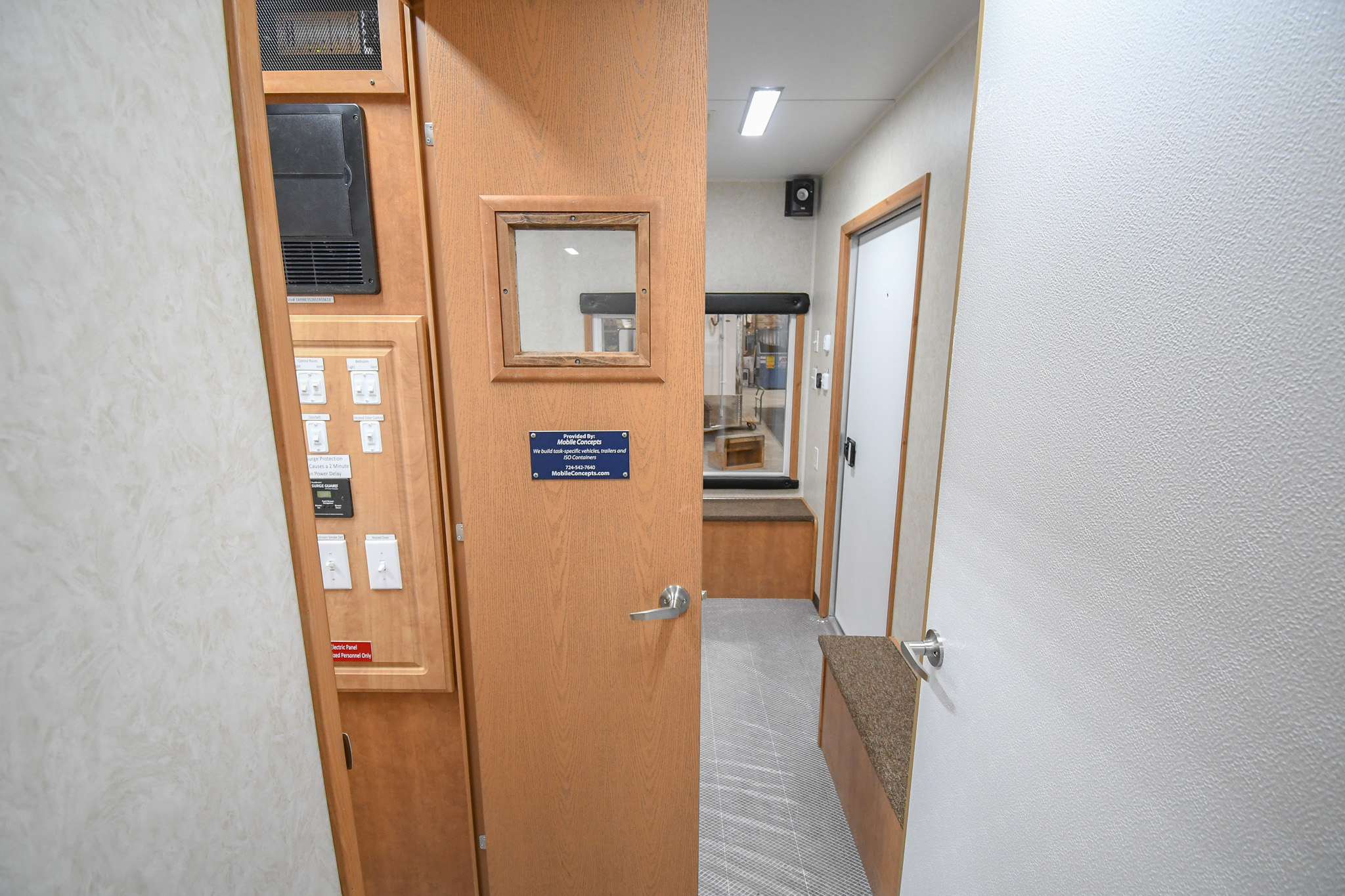 An interior view inside the unit for Modesto, CA. The door to the control room is open.